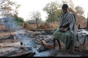an-adivasi-woman-in-her-burnt-house-in-dantewada